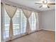 Inviting bedroom featuring neutral walls and light-filtering curtains at 6600 N Beulah Rd, Lithia Springs, GA 30122
