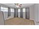 Calm bedroom featuring carpet, ceiling fan, and gray curtains at 6600 N Beulah Rd, Lithia Springs, GA 30122