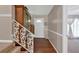 Warm and inviting foyer with hardwood floors and decorative staircase at 6600 N Beulah Rd, Lithia Springs, GA 30122