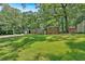 Traditional brick home with mature trees, detached garage and spacious front yard at 6600 N Beulah Rd, Lithia Springs, GA 30122