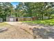 Traditional brick home with mature trees, detached garage and spacious driveway at 6600 N Beulah Rd, Lithia Springs, GA 30122