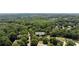 Aerial view showcasing the property at 161 Forestview Dr surrounded by lush trees at 161 Forestview Dr, Suwanee, GA 30024