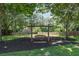 Private backyard featuring a relaxing swing set with views of the surrounding landscape at 161 Forestview Dr, Suwanee, GA 30024