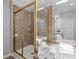 Elegant bathroom showcasing a shower with glass doors and a luxurious soaking tub at 161 Forestview Dr, Suwanee, GA 30024
