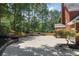 Extended driveway leading to brick home and featuring meticulous landscaping at 161 Forestview Dr, Suwanee, GA 30024