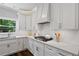 Updated kitchen featuring white subway tile, stainless steel appliances, and ample counter space at 161 Forestview Dr, Suwanee, GA 30024