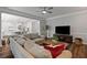 Comfortable living room showcasing an open-concept design, seamlessly connected to the modern kitchen at 161 Forestview Dr, Suwanee, GA 30024