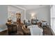 Inviting living room features hardwood floors, leather seating, and elegant decor with an open floor plan at 161 Forestview Dr, Suwanee, GA 30024