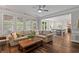 Open-concept living room featuring a comfortable sofa and seamless transition to the modern kitchen at 161 Forestview Dr, Suwanee, GA 30024