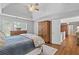 Spacious main bedroom with vaulted ceilings, wood floors, and ample closet space at 161 Forestview Dr, Suwanee, GA 30024