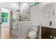 Updated bathroom features a glass enclosed shower with marble tile and a new wood vanity at 1835 Taylor Ave, East Point, GA 30344
