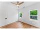 This bright bedroom boasts hardwood floors and two windows, providing ample natural light at 1835 Taylor Ave, East Point, GA 30344