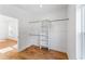 Bright, walk-in closet with built-in shelving and hanging rods for optimal storage space at 1835 Taylor Ave, East Point, GA 30344