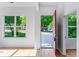 Bright entryway showcasing beautiful hardwood floors and a view of the green outdoors at 1835 Taylor Ave, East Point, GA 30344
