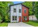 Contemporary home with a well-manicured lawn, modern siding, and ample parking space at 1835 Taylor Ave, East Point, GA 30344