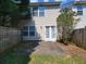 Cozy backyard featuring a small patio and a privacy fence, perfect for outdoor entertaining at 285 Fieldview Ln, Covington, GA 30016