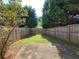 Private backyard with lush green grass and a wooden fence, perfect for outdoor relaxation at 285 Fieldview Ln, Covington, GA 30016