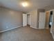Cozy bedroom featuring neutral walls, carpeted floors, and a closet for ample storage at 285 Fieldview Ln, Covington, GA 30016