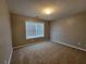 Bright bedroom with natural light from a large window and neutral carpeting at 285 Fieldview Ln, Covington, GA 30016
