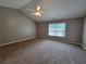 Bedroom with neutral carpet, vaulted ceiling, and fan at 285 Fieldview Ln, Covington, GA 30016
