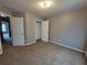 Inviting bedroom with plush carpeting and convenient closet access at 285 Fieldview Ln, Covington, GA 30016