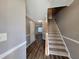 Entryway with wood-look flooring, stairs to the second level, and neutral paint at 285 Fieldview Ln, Covington, GA 30016