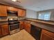 Kitchen featuring stainless steel appliances and granite countertops at 285 Fieldview Ln, Covington, GA 30016
