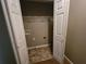 Convenient laundry closet with washer and dryer hookups and storage shelves at 285 Fieldview Ln, Covington, GA 30016