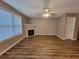 Living room featuring a fireplace, hardwood floors, and natural light at 285 Fieldview Ln, Covington, GA 30016