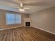 Living room featuring a fireplace, hardwood floors, and natural light at 285 Fieldview Ln, Covington, GA 30016