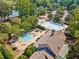 Aerial view of community pools, lounge areas, and lush surrounding greenery at 3845 Overlake Dr, Cumming, GA 30041