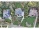 An expansive aerial view displays a home set amongst verdant landscaping and mature trees at 3845 Overlake Dr, Cumming, GA 30041
