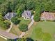 Aerial view showcases the home's landscaping and setting within a desirable neighborhood at 3845 Overlake Dr, Cumming, GA 30041