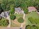 Aerial view showcases the home's landscaping and setting within a desirable neighborhood at 3845 Overlake Dr, Cumming, GA 30041