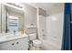 Cozy bathroom featuring tub-shower, toilet, and vanity with a white countertop sink at 3845 Overlake Dr, Cumming, GA 30041