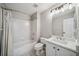 Well-lit bathroom featuring a shower-tub combo, neutral paint, and updated vanity with modern fixtures at 3845 Overlake Dr, Cumming, GA 30041