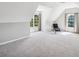 Bright bonus room with dormer windows, neutral paint and plush carpeting at 3845 Overlake Dr, Cumming, GA 30041
