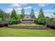 Community entrance with stone signage and manicured landscaping at 3845 Overlake Dr, Cumming, GA 30041