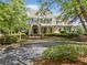 Traditional-style home with a covered front porch, green shutters, and professionally landscaped front yard at 3845 Overlake Dr, Cumming, GA 30041