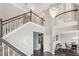 Spacious foyer with hardwood floors, staircase, chandelier, and view to formal dining room at 3845 Overlake Dr, Cumming, GA 30041
