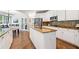 Bright kitchen features granite countertops, stainless steel appliances, white cabinets, and a central island at 3845 Overlake Dr, Cumming, GA 30041