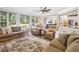 Spacious living room filled with natural light with view to a dining room at 3845 Overlake Dr, Cumming, GA 30041