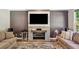Living room with decorative fireplace and mounted TV at 3845 Overlake Dr, Cumming, GA 30041
