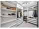 Spacious walk-in closet with custom shelving, hanging rods, and ample storage for clothes and accessories at 3845 Overlake Dr, Cumming, GA 30041