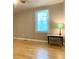 Bedroom with hard wood floors, neutral colored walls, and good natural light at 7680 Banks Mill Road Rd, Douglasville, GA 30135
