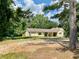 Inviting single-story home with a covered porch, stone accents, and a spacious front yard at 7680 Banks Mill Road Rd, Douglasville, GA 30135