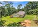 Charming single-story home nestled on a lush green lot with mature trees providing privacy and shade at 7680 Banks Mill Road Rd, Douglasville, GA 30135