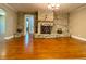 Stone fireplace detail with decorative ironwork and adjacent doorway at 7680 Banks Mill Road Rd, Douglasville, GA 30135