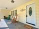 Covered front porch with seating and decor, creating a welcoming entrance to the home at 7680 Banks Mill Road Rd, Douglasville, GA 30135
