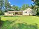 Charming single-story home with a well-manicured lawn and covered front porch at 7680 Banks Mill Road Rd, Douglasville, GA 30135